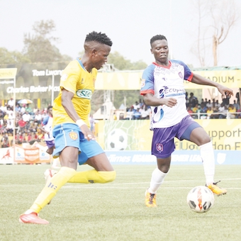 SC Villa’s Ivan Bogere (R) Gaddafi FC’s Nicholas Kasozi