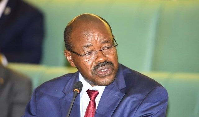 amos-lugolobi-in-parliament-1 Minister Amos Lugolobi decided to use the iron sheets meant for people of Karamoja. Photo: New Vision to roof his cow shed