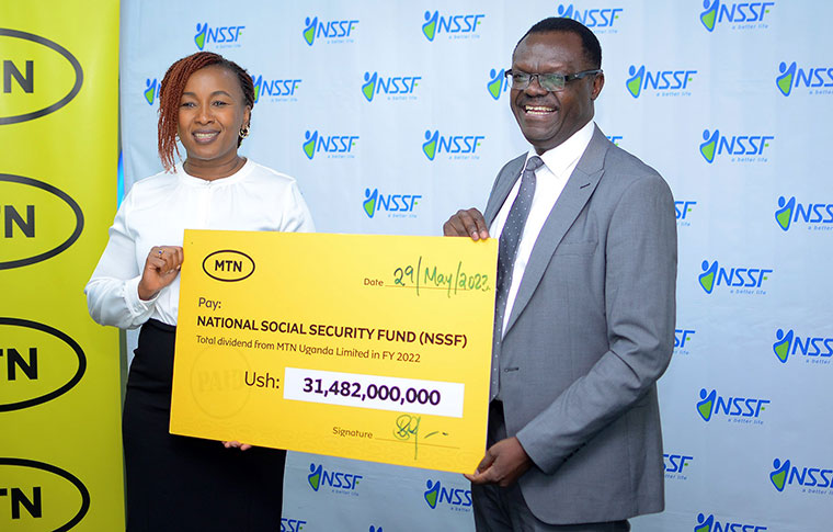 patrick-ayota-receives-a-dummy-cheque-from-sylvia-mulinge