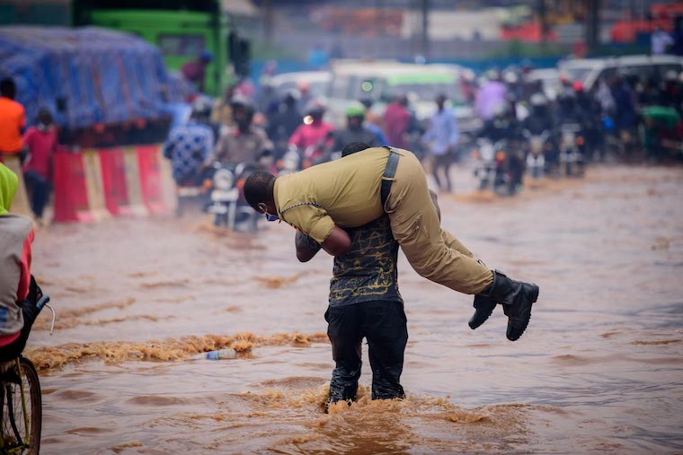 police-officer-carried-across-city-floods