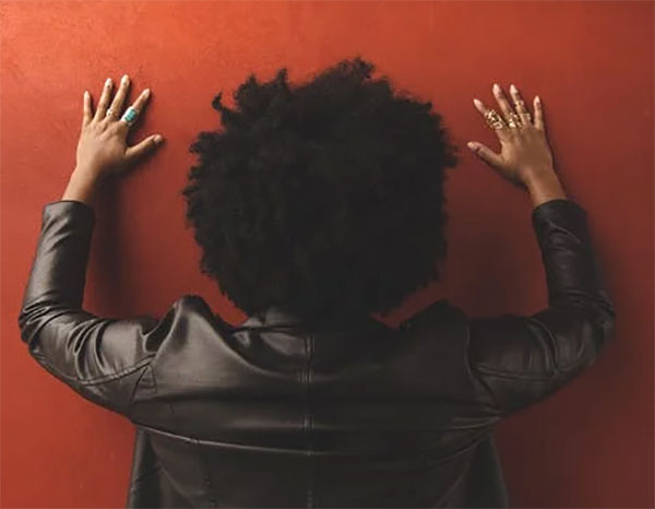 woman-facing-wall