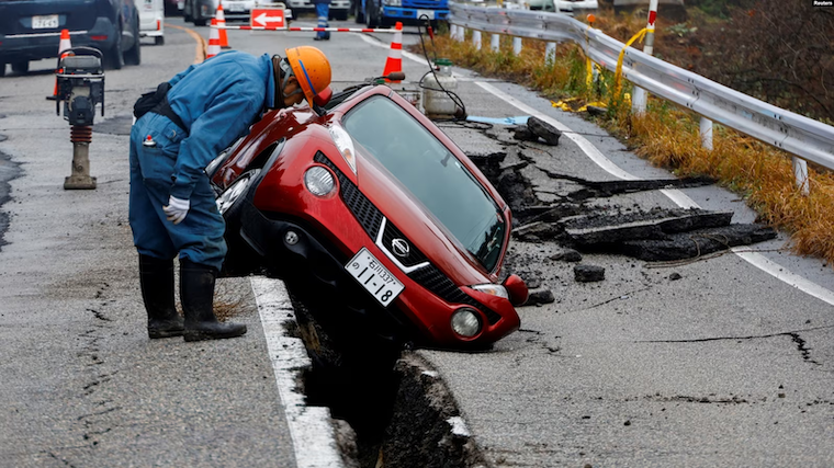 car-stuck-on-a-broken-road-in-japan-1