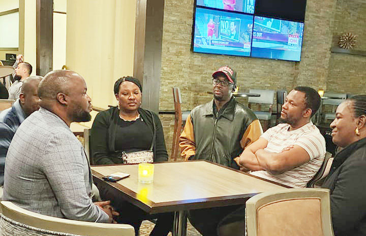 yasin-bakaluba-holding-a-meeting