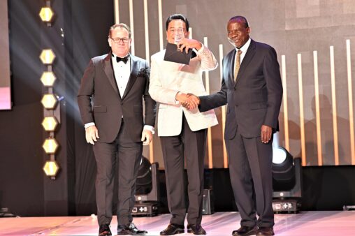 dr-ketan-morjaria-the-non-executive-director-and-founding-member-receives-a-life-achievement-award-from-finance-minister-matia-kasaija-r-flanked-by-im-chief-executive-officer-mr-robin-bairstow-1-1-50-1