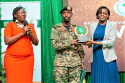 maj-gen-sabiiti-muzeeyi-general-manager-luwero-industries-ltd-nec-handing-over-the-award-to-barbara-dokoria-r-the-stanbic-bank-ag-executive-director-looking-is-diana-ondoga-the-banks-head-of-csi-1-1