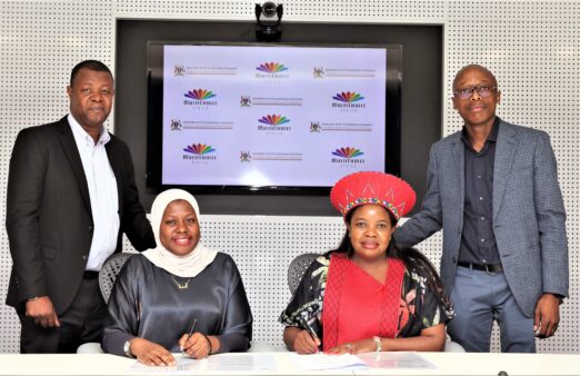 dr-aminah-zawedde-the-ps-ministry-of-ict-and-national-guidance-of-uganda-with-fhulufhelo-badugela-seated-the-ceo-for-multichoice-africa-holdings-with-two-other-multichoice-officials-522x338-1
