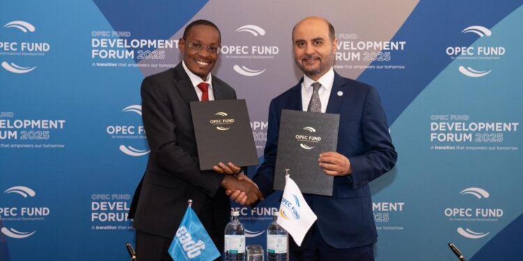 East African Development Bank acting director general Benard Mono (right) and OPEC Fund President Dr. Abdulhamid Alkhalifa sign a loan agreement in Vienna.