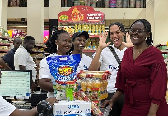 Flexipay Trolley Dash winner Kyomuhendo Leticia ejoying her moment as she checked out of the supermarket