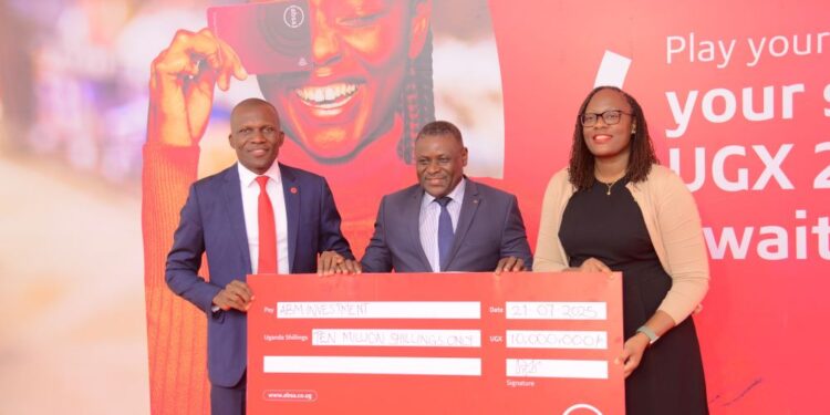 Moses Rutahigwa, Retail and Business Banking Director Absa Bank (left) and Helen Basuta Nangonzi, Absa Bank Uganda's marketing and Customer Experience (right) with Mr Pafra Mulambuzi, Director at ABM Investments