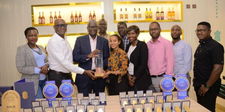 Uganda Breweries MD Andrew Kilonzo with his team with the award
