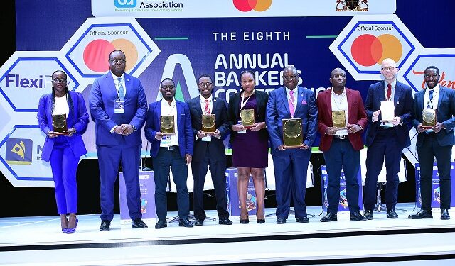 A photo moment of Stanbic's Mumba after awarding sponsors for the Annual Banker's Conference