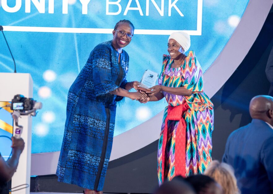 awarding-nalongo-a-client-who-has-been-with-opportunity-bank-for-30-years-882x628-1