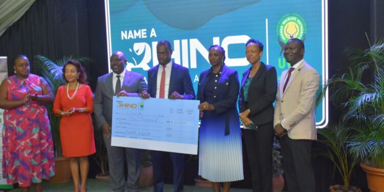 (L-R) Chairperson Association of Uganda Tour Operators Civy Tumusiime, President Uganda Tourism Association Yogi Biriggwa, UWA Executive Director Dr. James Musinguzi, Minister of State for Tourism Martin Mugara, CEO Presidential CEO's Forum Irene Birungi Mugisha, CEO UTB Juliana Kagwa and the UTB Marketing Manager Francis Nyende at the launch of the Rhino Naming Ceremony