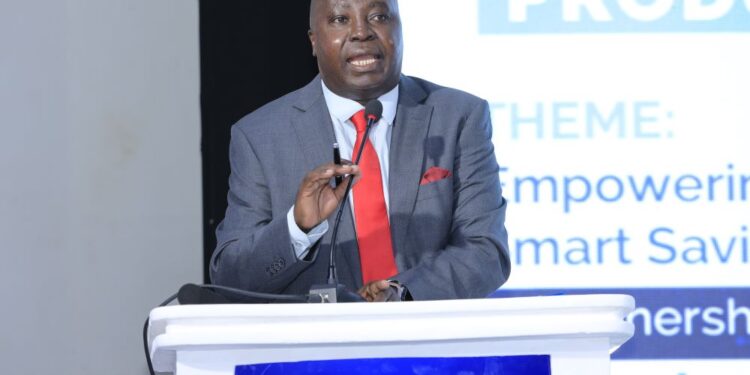 Japheth Aritho, managing director of Airtel Mobile Commerce Uganda, delivers his address during the launch of the SchoolPay Savings scheme.